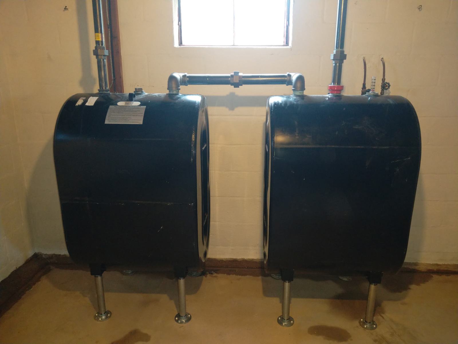 Twin oil tanks installed and manifolded by JBrick Heating and Cooling